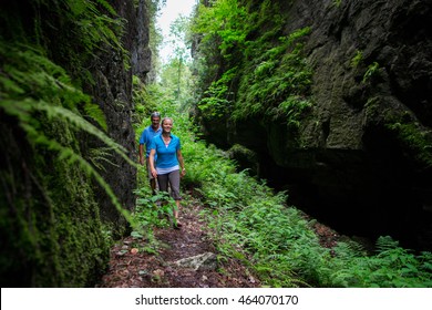 Older Couple Hiking In The Forest