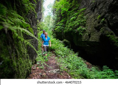 Older Couple Hiking In The Forest