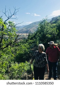 An Older Couple Hiking In The Utah Mountains.