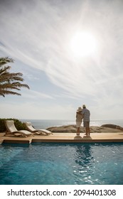 Older Couple Hugging By Pool