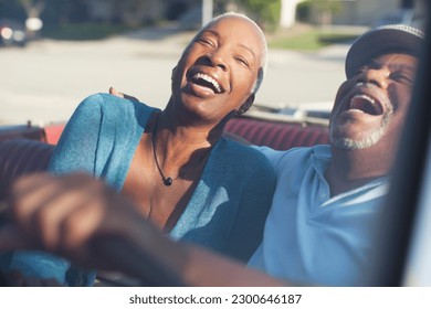 Older couple laughing in convertible - Powered by Shutterstock