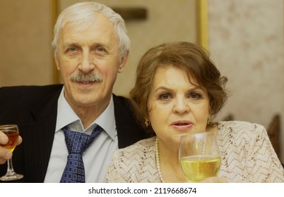 An Older Couple On A Holiday With A Glass Of Wine