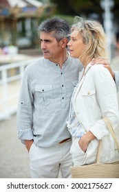 Older Couple Outdoors Looking Away