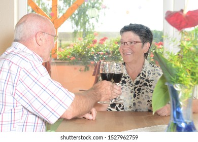 Older Couple Over A Glass Of Wine 