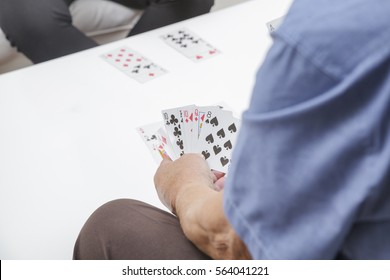 Older Couple Playing Card Game