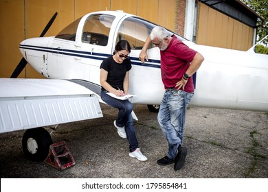 The Older Couple Prepares To Fly In A Smaller Airport With Good Fun And Laughter