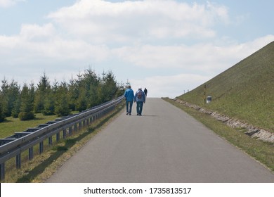 Older Couple Walking On He Street