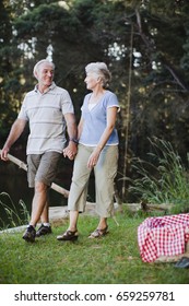 Older Couple Walking Together Outdoors