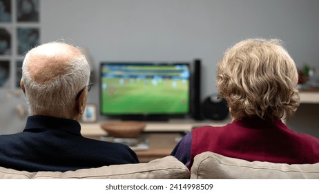 older couple watching tv at home - Powered by Shutterstock