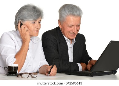 Older Couple In The Workplace On A White Background