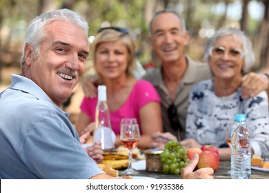 Older Couples Enjoying An Alfresco Lunch