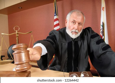 Older, distinguished judge making his ruling in the courtroom