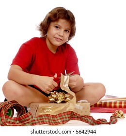 Older Elementary Girl Wrapping A Gift For Christmas.