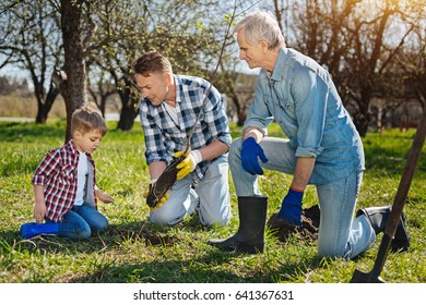 Older Family Members Teaching Kid How To Care About Nature