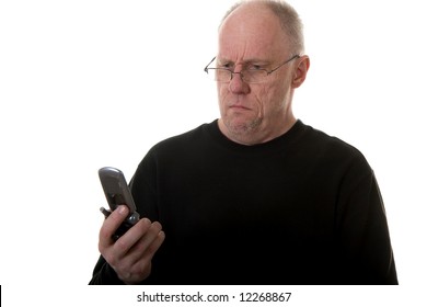 An Older Guy In A Black Shirt Looking At His Cell Phone Confused Or Wrong Number
