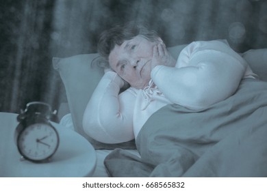 Older Lady Suffering From Insomnia Is Trying To Sleep