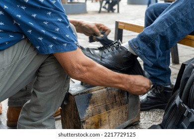 older latino man, dark skinned, cleaning and shining shoes, happy with his profession mexico guadalajara, latin america - Powered by Shutterstock