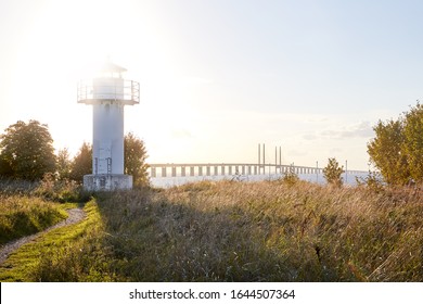 Older Lighthouse Outside Malmö That Was Shut Down In 2001 After Öresund Bridge (Öresundsbron) Was Completed In 2000. Öresund Bridge Stretches Out In The Background.