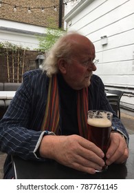 Older Man Drinking Beer In An English Pub