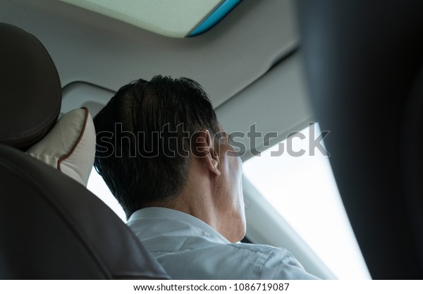 older man\
driving