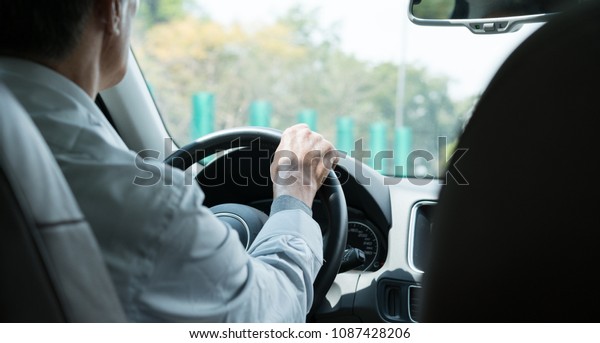 older man\
driving