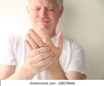 An Older Man Has Numbness And Tingling In His Hand