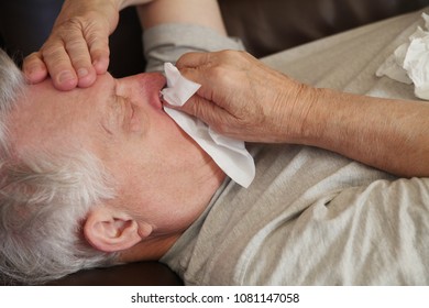 Older Man Has Runny Nose And Headache