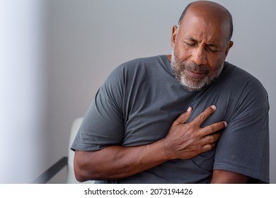 Older man having chest pains - Powered by Shutterstock