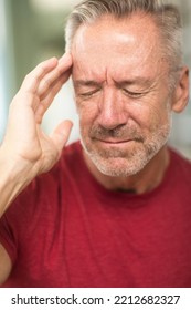 Older Man Having A Severe Headache.