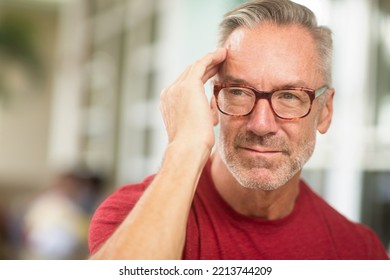 Older Man Having A Severe Headache.