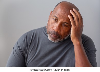 Older Man Holding His Head. Headache Not Feeling Well. 