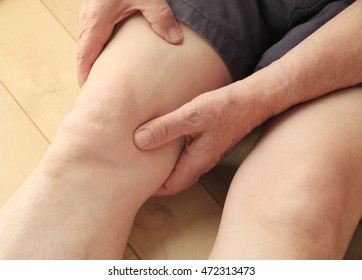 Older Man Indicates Area Of Pain On His Thigh.