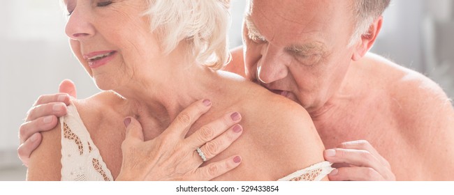 Older Man Kissing With Love His Wife In Lingerie