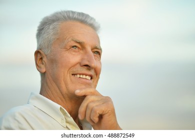 Older Man On  Background Of The Sky