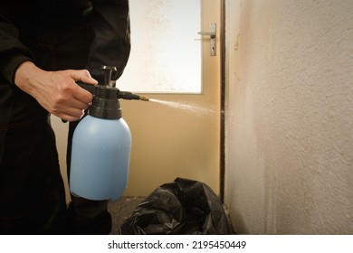 Older Man In Overall Moisturing Old Wallpapers In Apartment Room