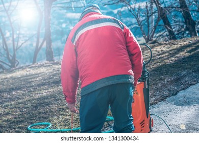 
The Older Man Prepares Car Wash Equipment