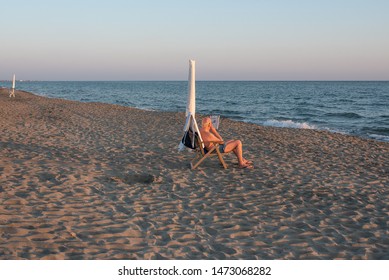 Older Man Sitting On The Beach