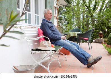 Older Man Sitting On Porch