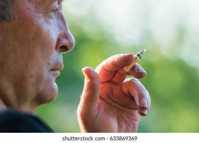 Older Man Smoking A Cigarette - Nicotine Addiction 