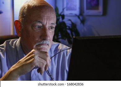 Older Man Studying Computer, Horizontal