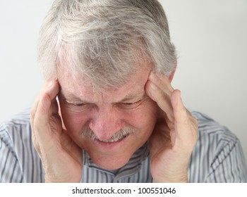 Older Man Suffers From A Very Bad Headache