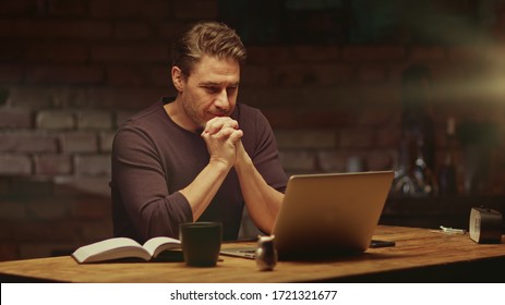 Older Man Tele Working With Laptop Computer At Home Office In Dark Room, Thinking, Looking Busy.