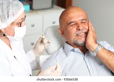 Older Man With Toothache At The Dentist