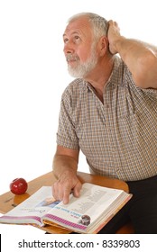 Older Man Trying To Think While Reading A Textbook Back In School