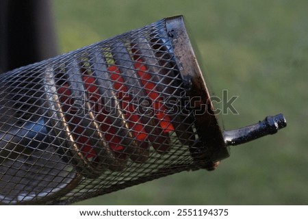 Older man uses two types of smoke machine generators on outdoor location