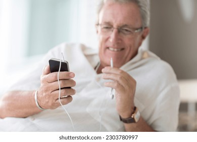 Older man using cell phone