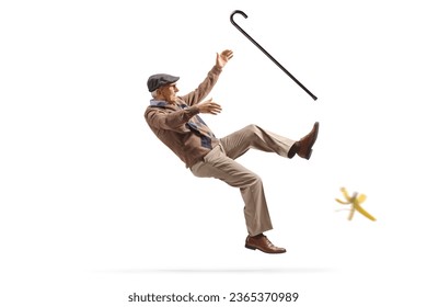 Older man with a walking cane slipping on a banana skin isolated on white background - Powered by Shutterstock