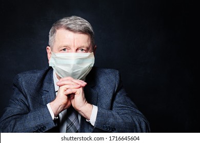 Older Man Wearing Medical Face Mask On Black Background