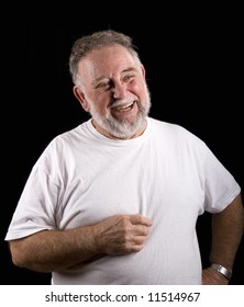 An Older Man In A White T-shirt On A Black Background Laughing