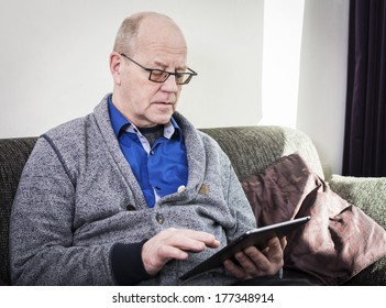 Older Man Working On Tablet Pc